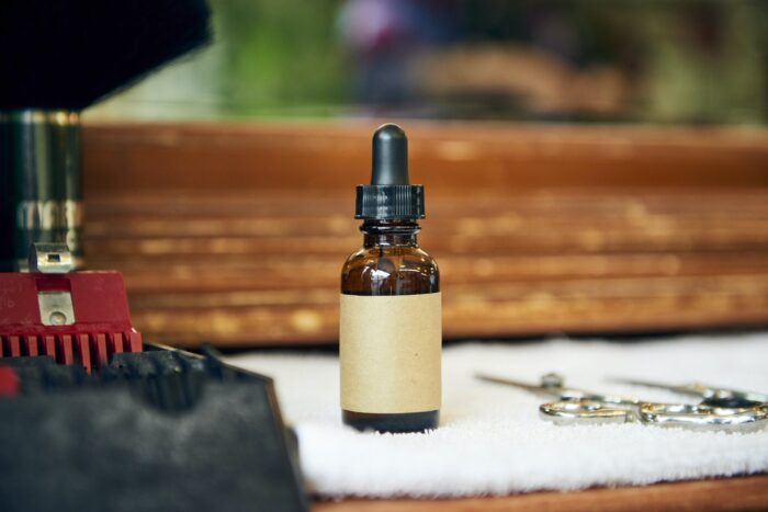 White label beard oil sits on a table