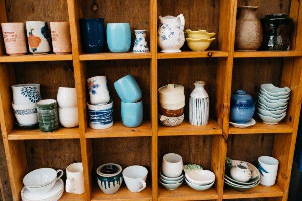 Shelving unit full of hand potted vases and other vessels