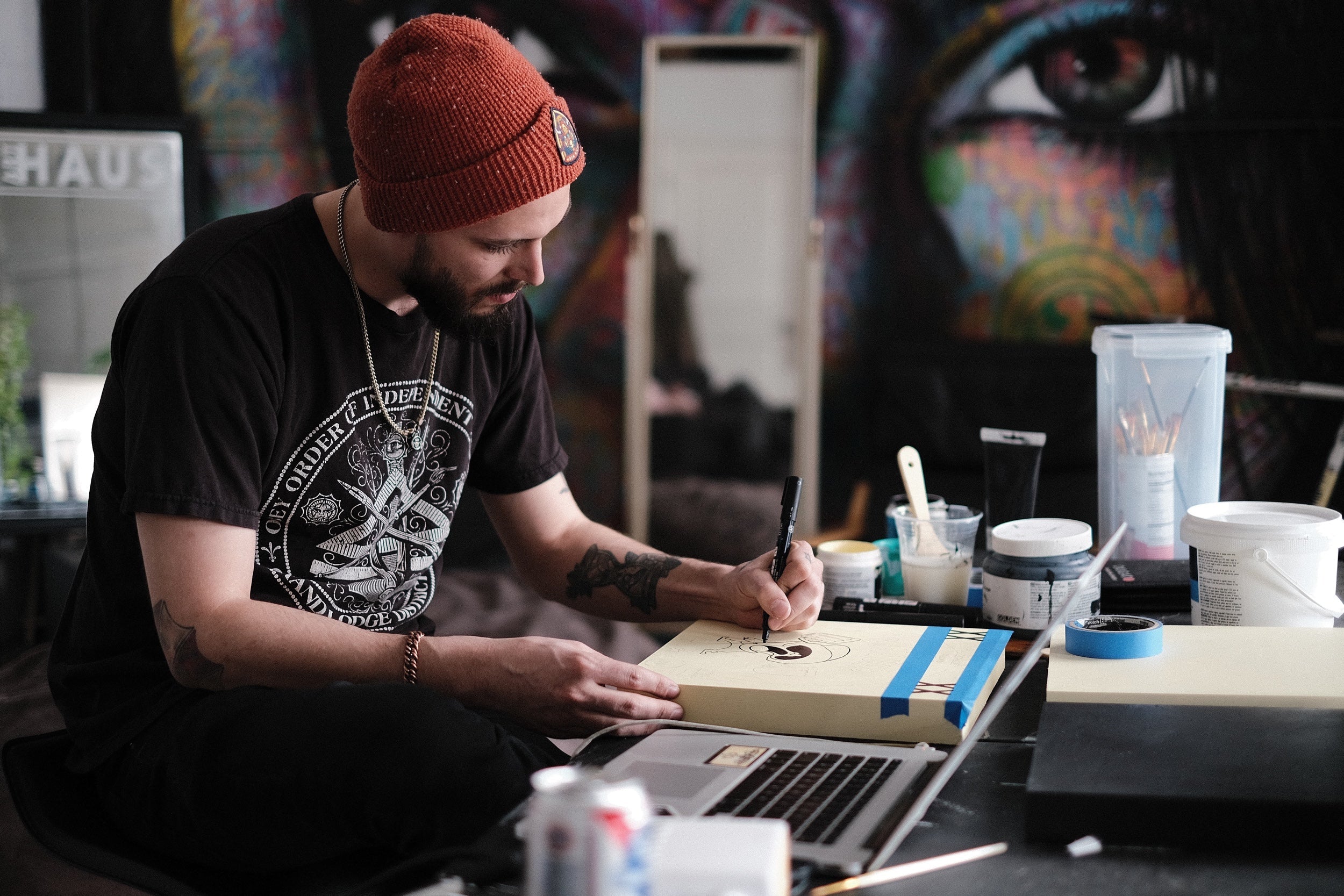 A painter works on art in his studio