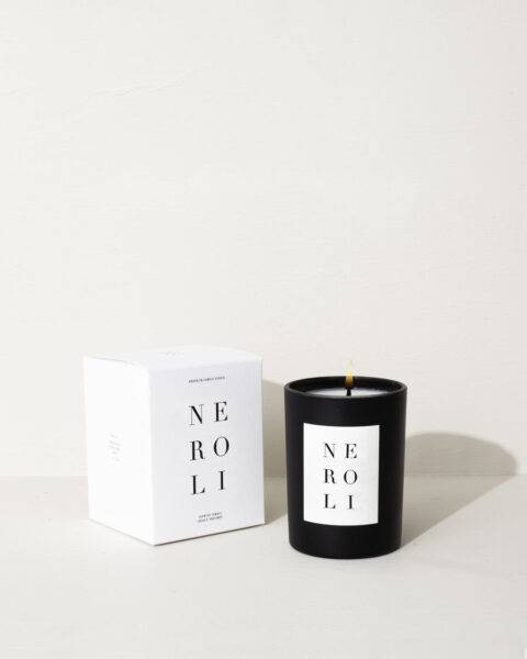 Neroli-scented candle next to its elegant box from vegan candle business Brooklyn Candle Studio