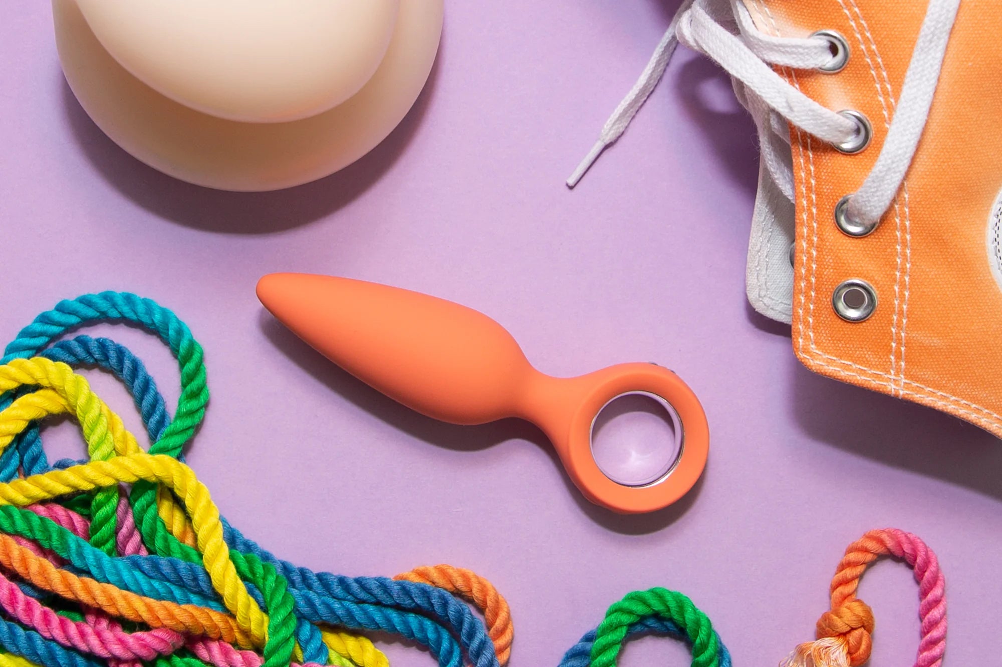 Emojibator flatlay of a sex toy and rope